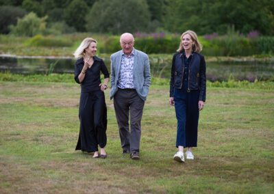 Three people walking in nature