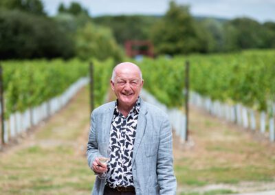 An old man with a glass of wine